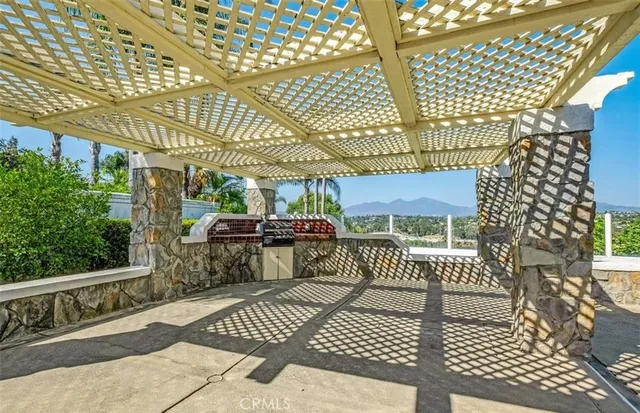a view of a chairs and table in the patio