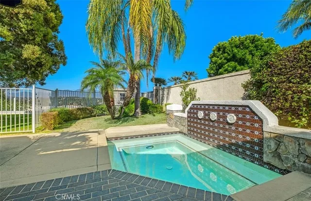 a view of a beach with a palm tree in the background