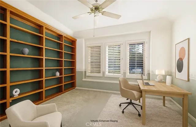 a view of a livingroom with workspace and a couch