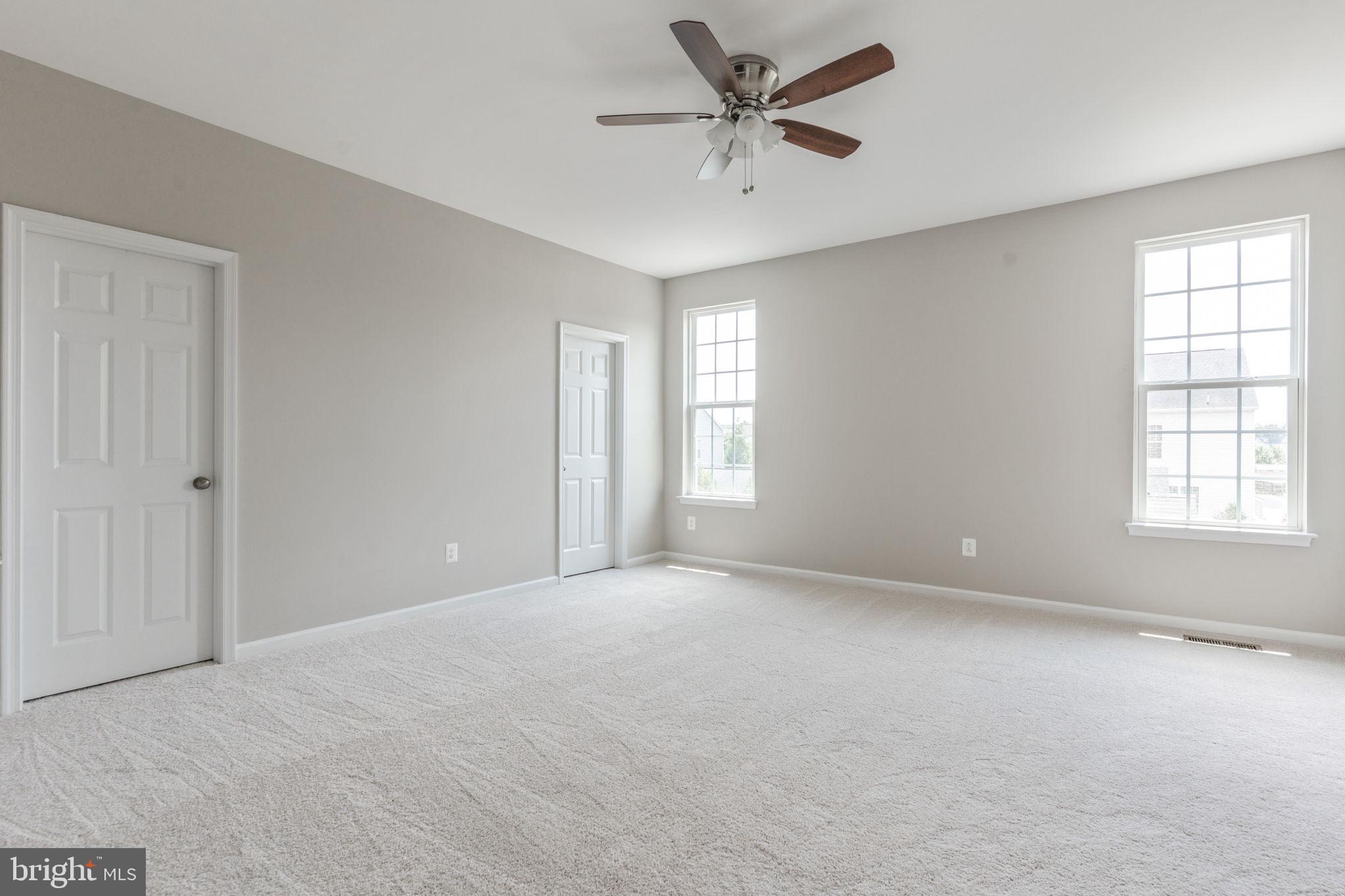12021 Spring Beauty Road Bristow, VA 20136 - Photo 18 of 43 a view of an empty room with a window