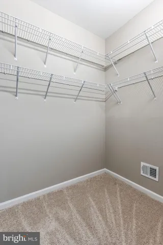 a view of a room with racks on the wall