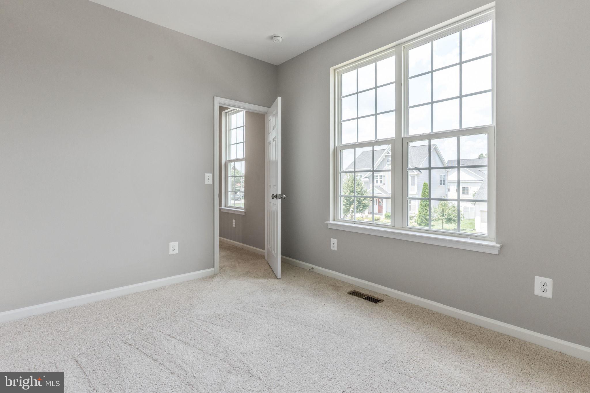 12021 Spring Beauty Road Bristow, VA 20136 - Photo 22 of 43 an empty room with windows and closet
