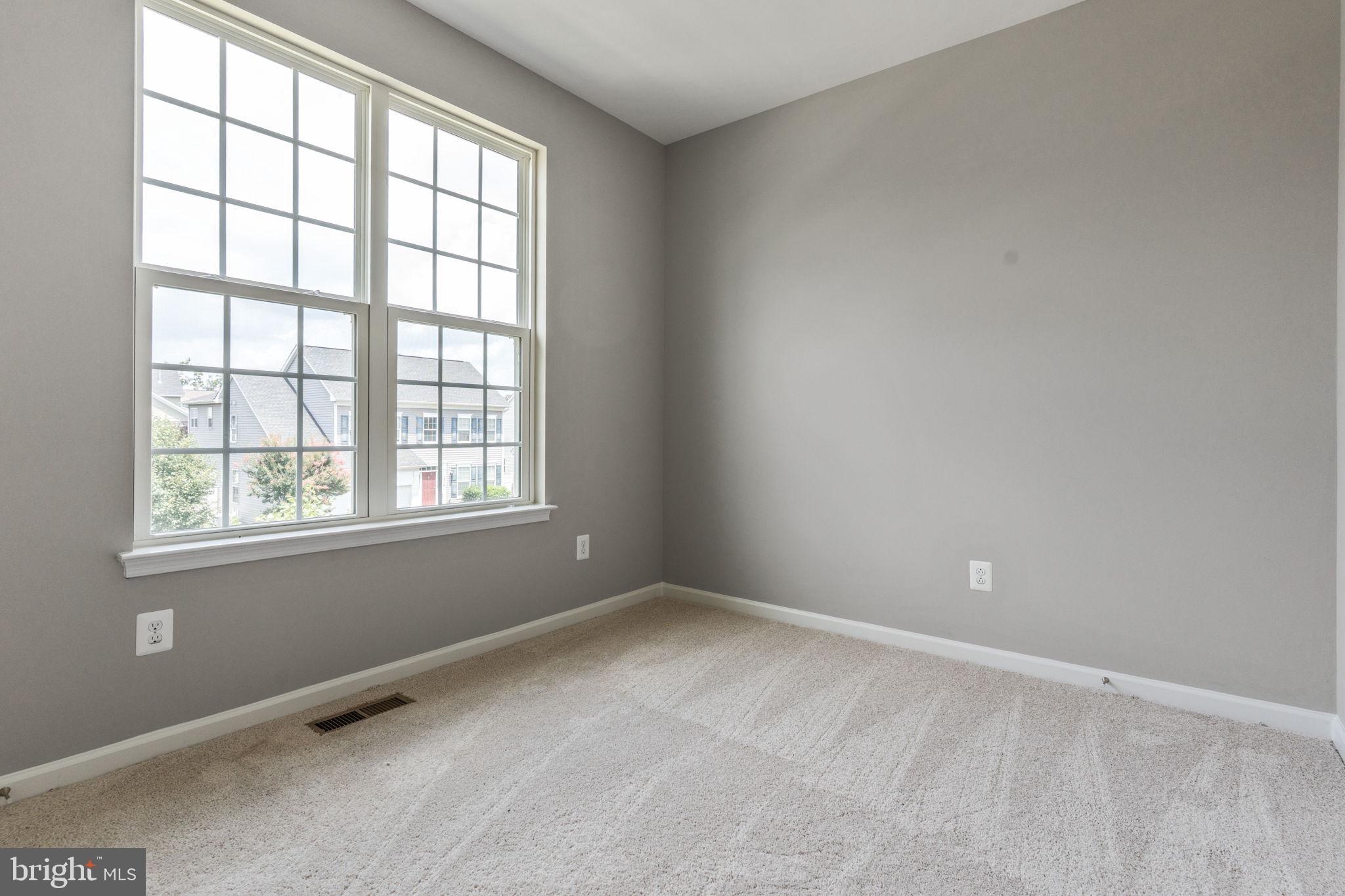 12021 Spring Beauty Road Bristow, VA 20136 - Photo 23 of 43 an empty room with a window