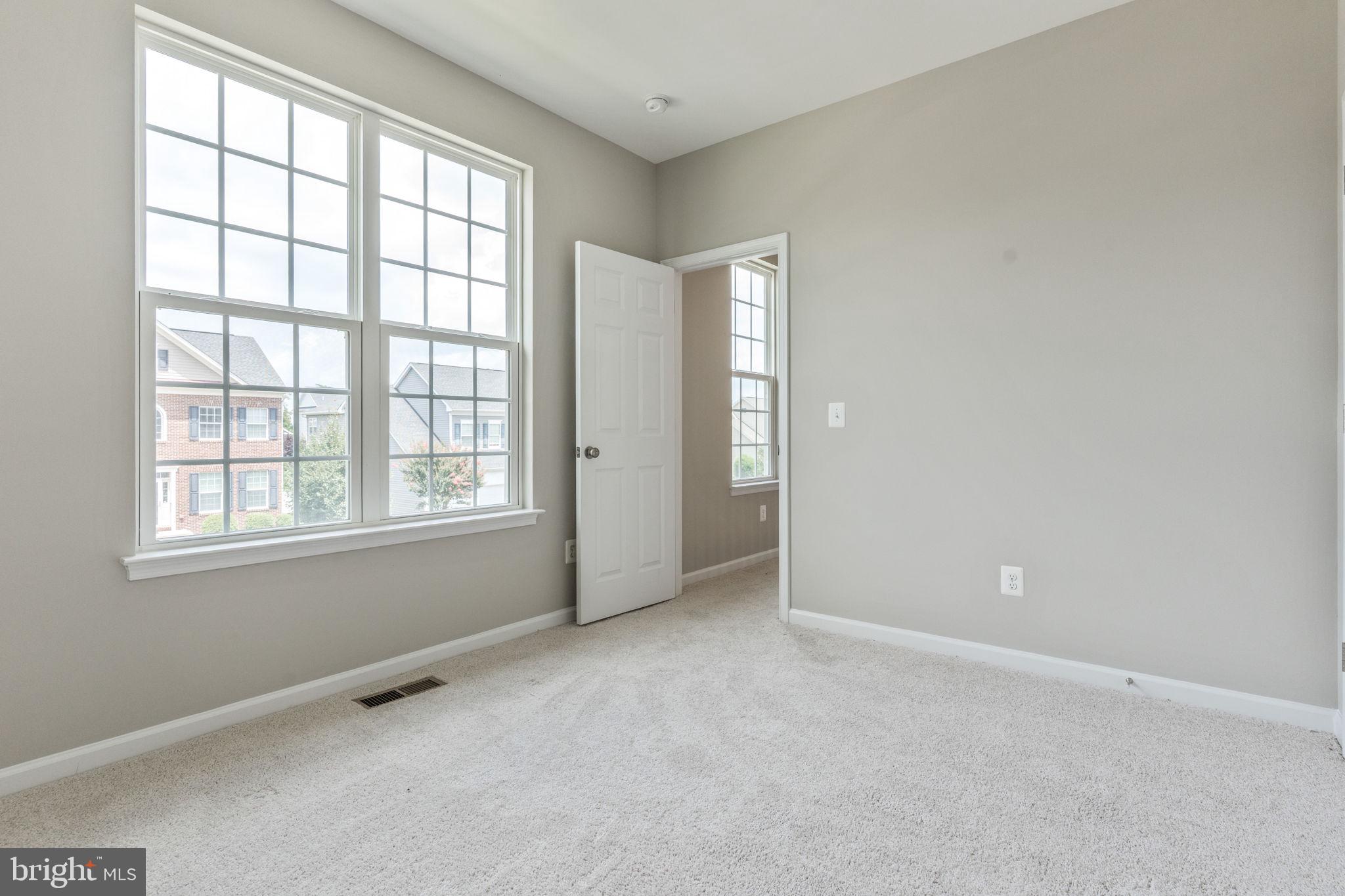 12021 Spring Beauty Road Bristow, VA 20136 - Photo 24 of 43 an empty room with windows and closet