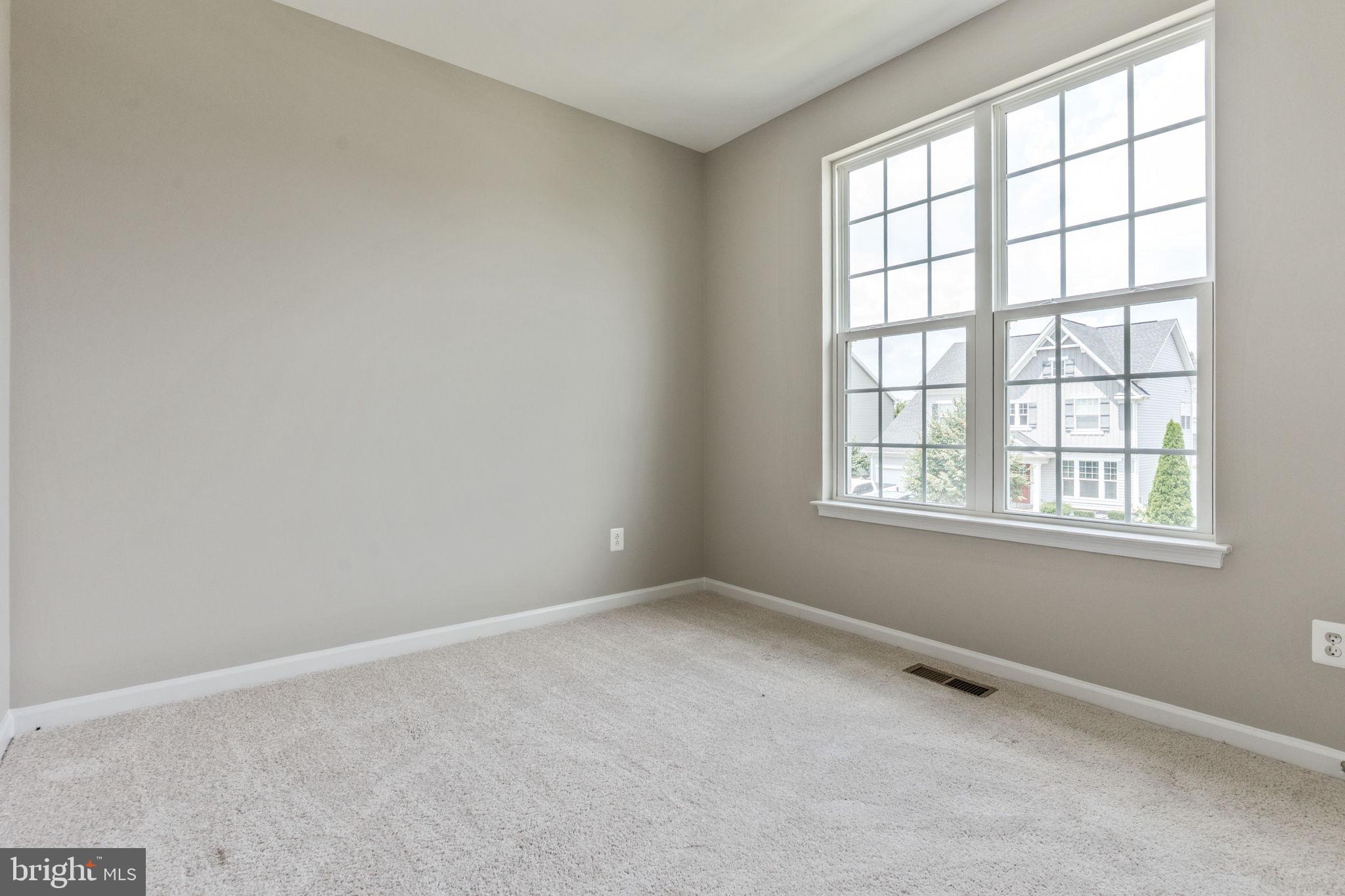 12021 Spring Beauty Road Bristow, VA 20136 - Photo 25 of 43 an empty room with a window