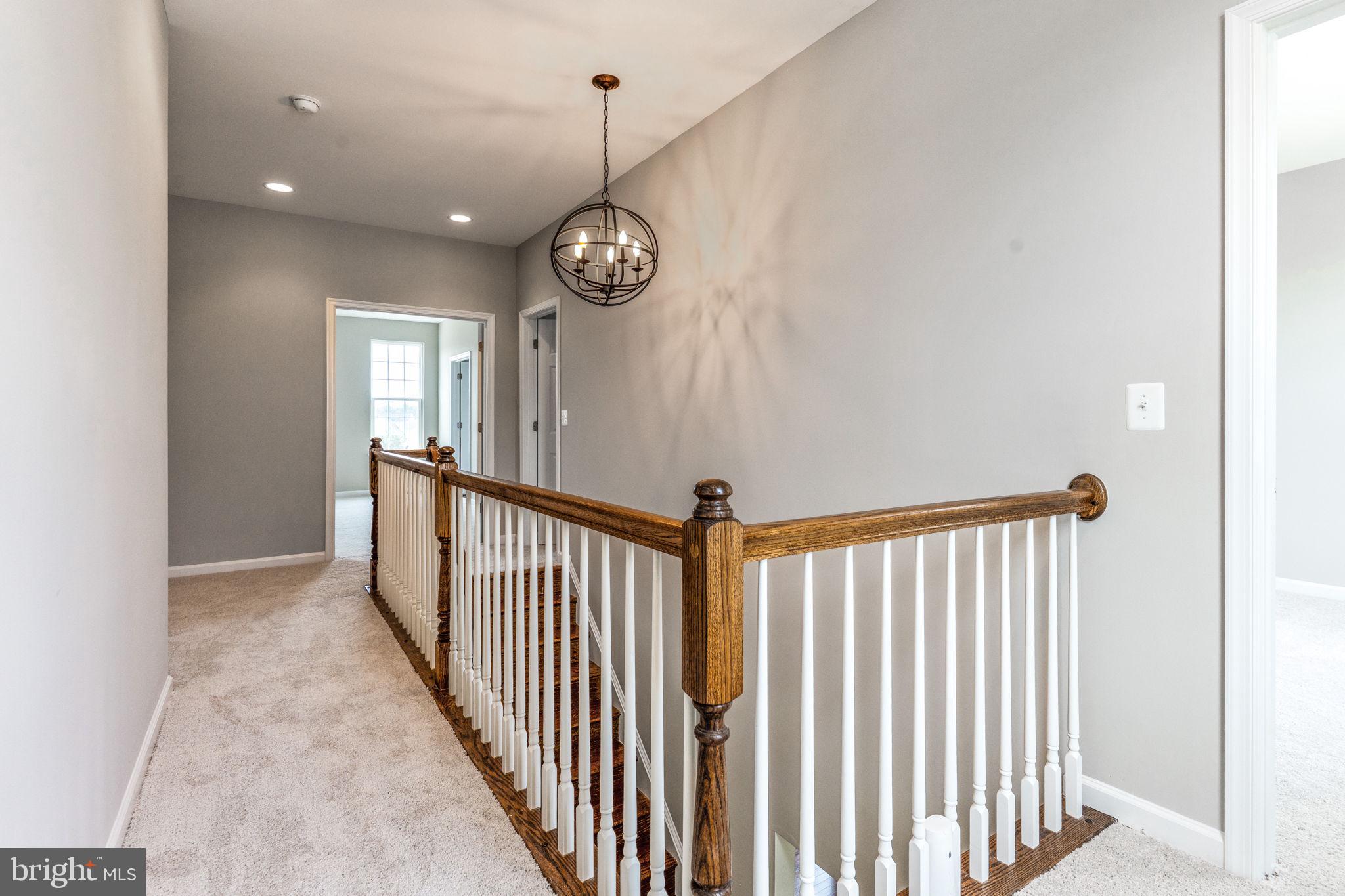 12021 Spring Beauty Road Bristow, VA 20136 - Photo 26 of 43 a view of a hallway with a window