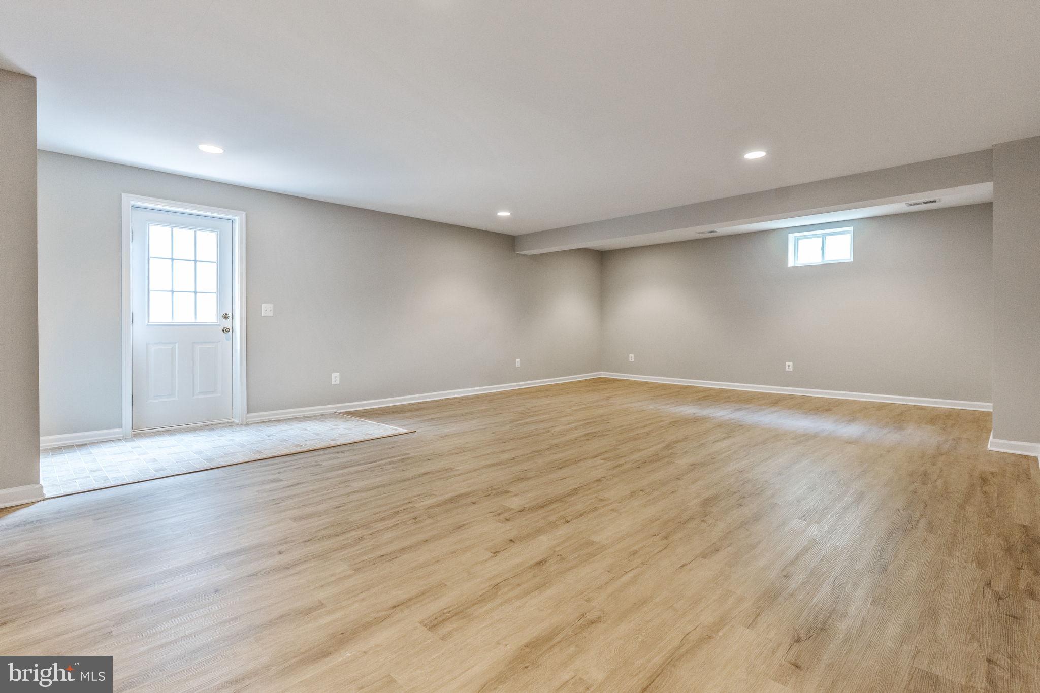 12021 Spring Beauty Road Bristow, VA 20136 - Photo 32 of 43 a view of empty room with wooden floor