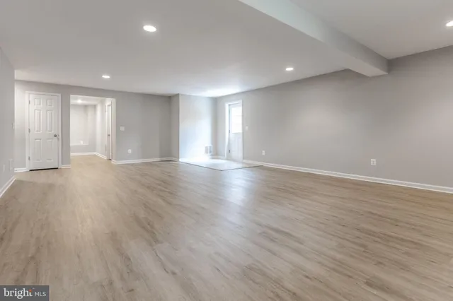 a view of a room with wooden walls