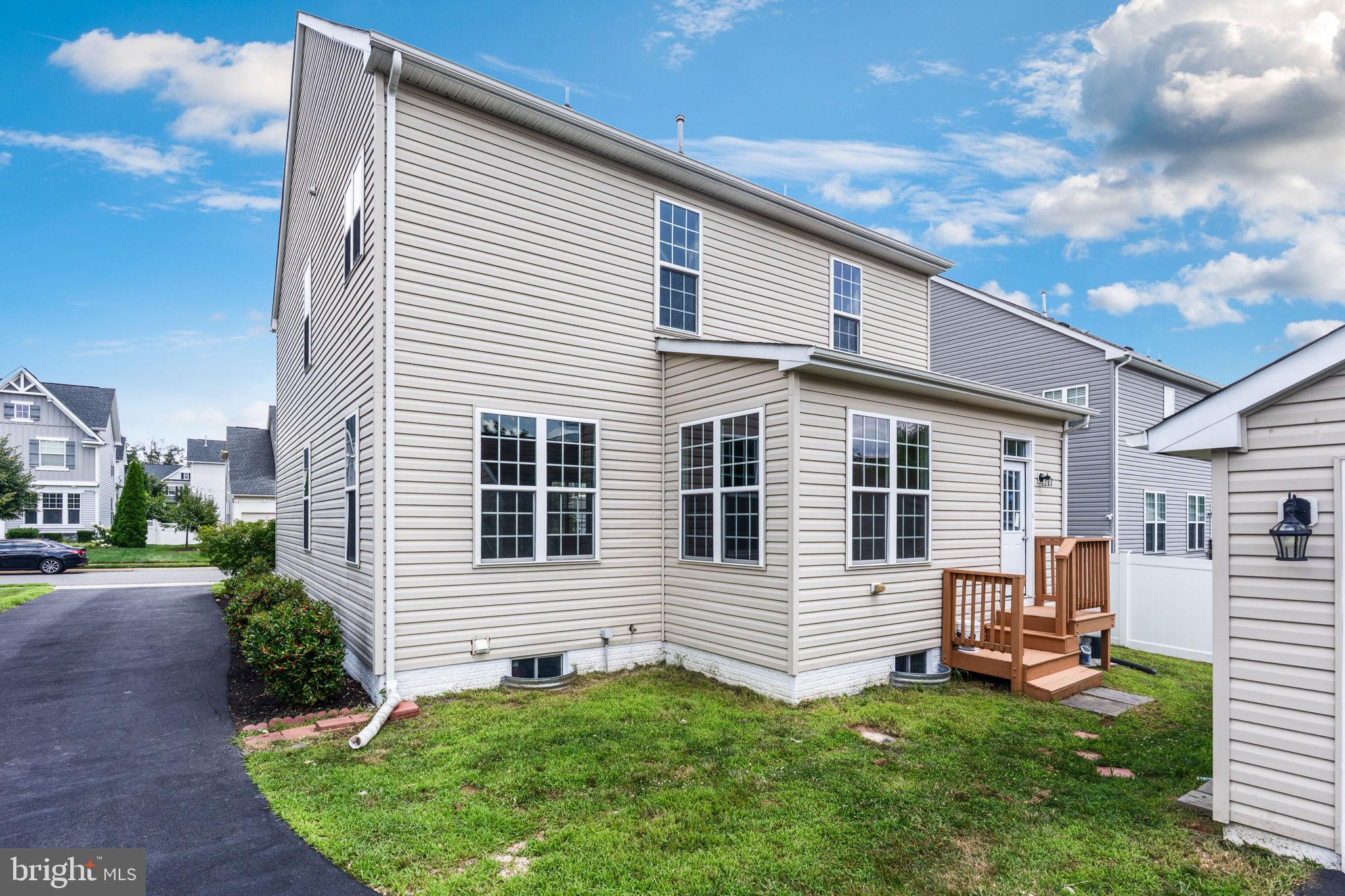 12021 Spring Beauty Road Bristow, VA 20136 - Photo 37 of 43 a backyard of a house with barbeque oven and fence