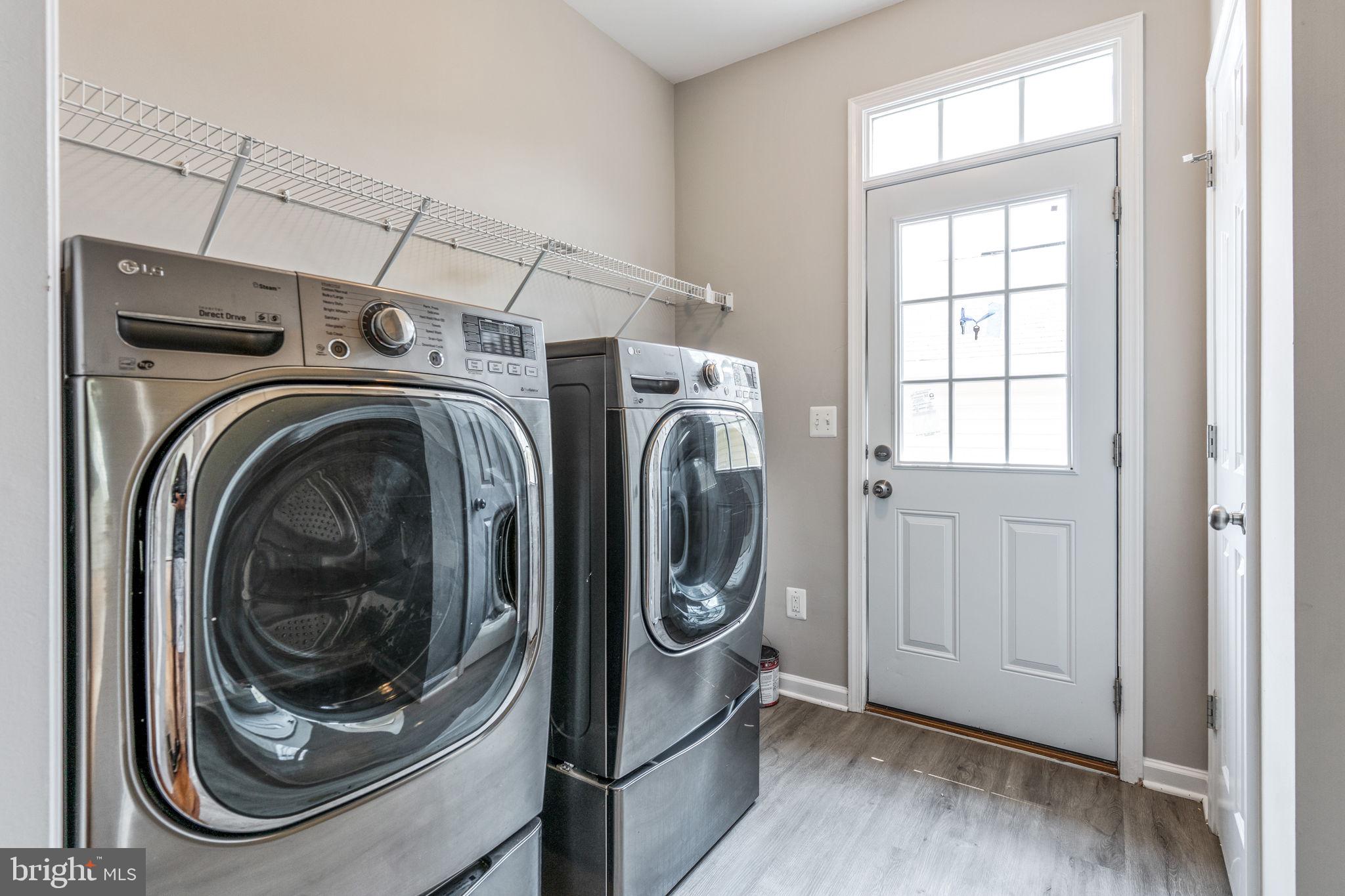 12021 Spring Beauty Road Bristow, VA 20136 - Photo 6 of 43 a utility room with dryer and washer