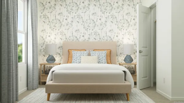 a bedroom with a bed and a mirror