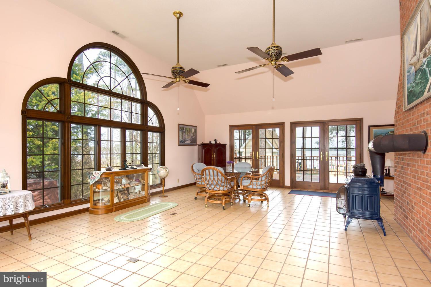 806 Seabreeze Road Cambridge, MD 21613 - Photo 8 of 41 Large Florida room with wood stove.