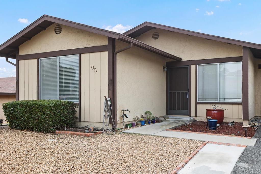 4537 Beverly Glen Drive Oceanside, CA 92056 - Photo 1 of 30 a front view of a house with garden