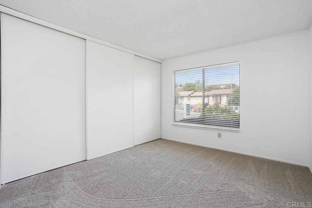 4537 Beverly Glen Drive Oceanside, CA 92056 - Photo 13 of 30 a view of an empty room with a window