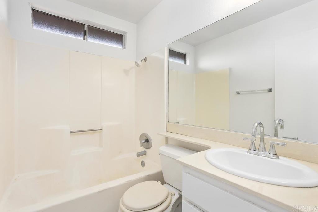 4537 Beverly Glen Drive Oceanside, CA 92056 - Photo 14 of 30 a bathroom with a sink toilet and shower
