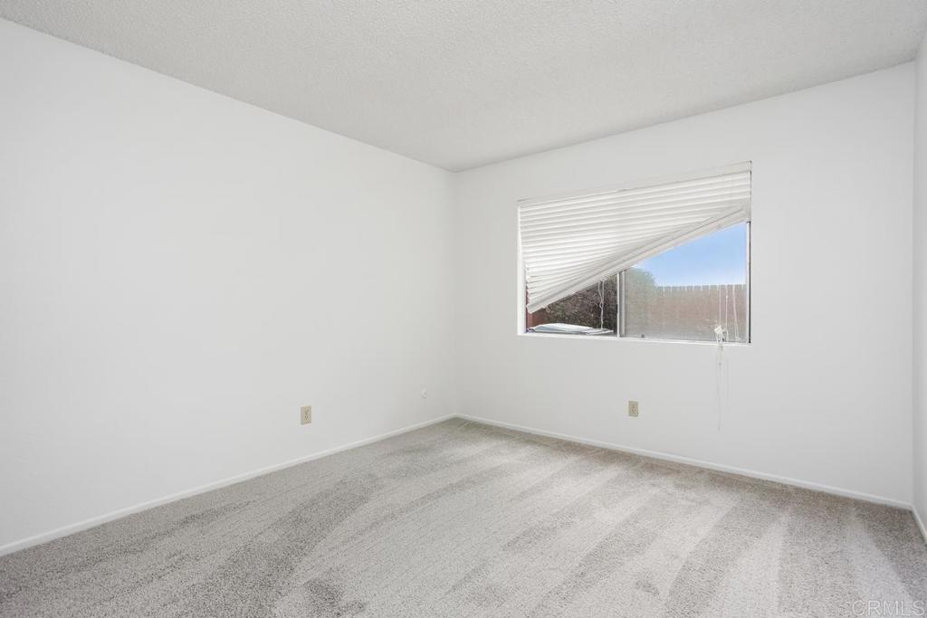 4537 Beverly Glen Drive Oceanside, CA 92056 - Photo 15 of 30 an empty room with a window