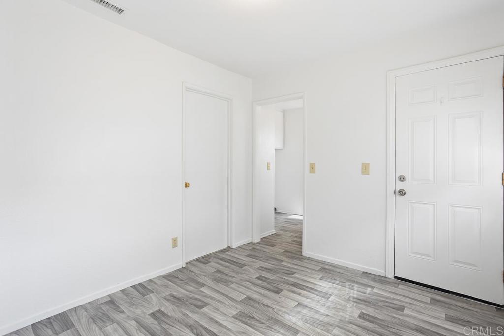 4537 Beverly Glen Drive Oceanside, CA 92056 - Photo 27 of 30 a view of a room with wooden floor