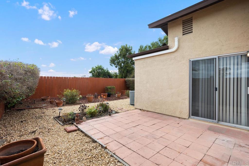 4537 Beverly Glen Drive Oceanside, CA 92056 - Photo 30 of 30 a backyard of a house with lots of green space and outdoor seating