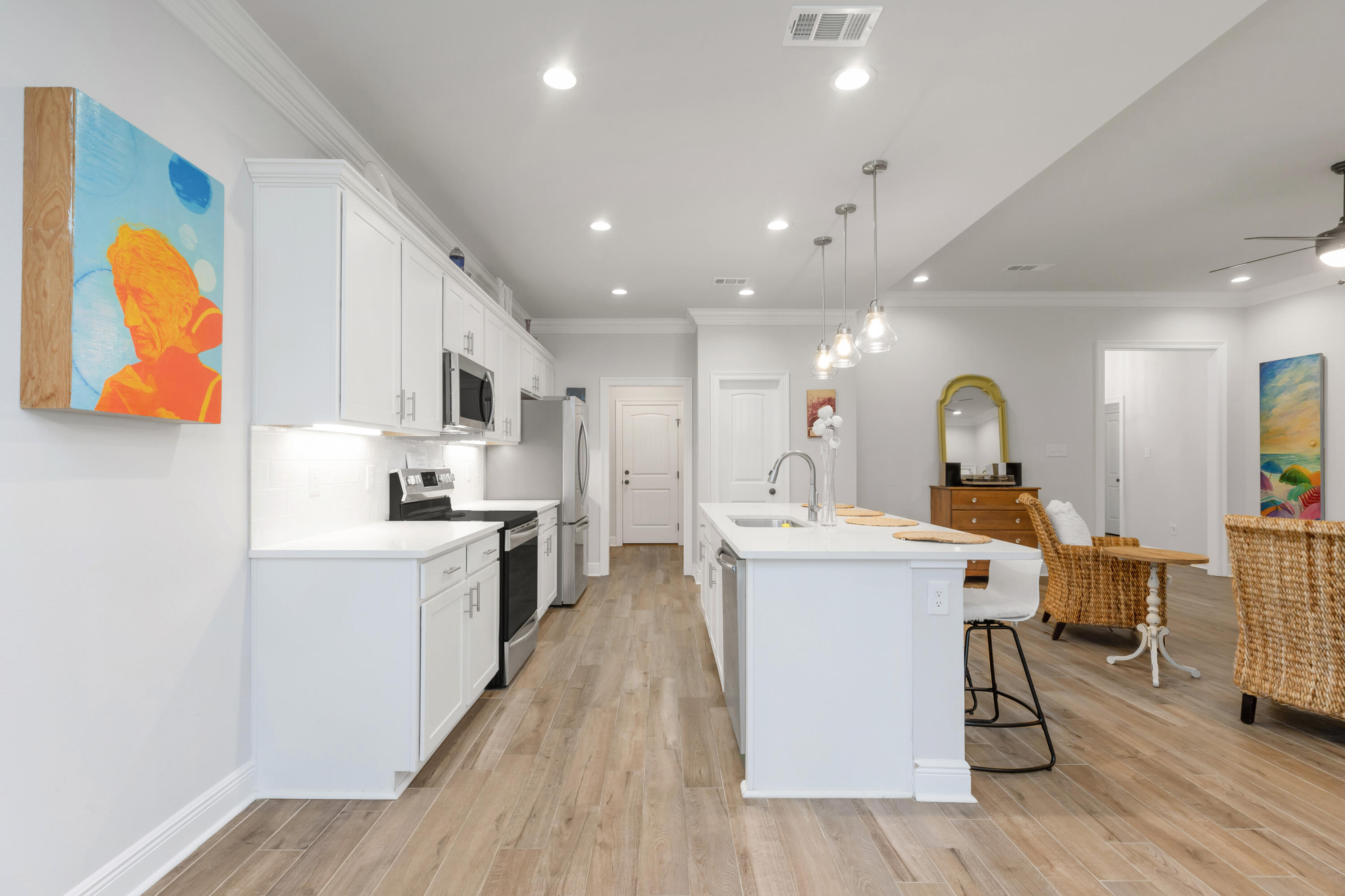 27 Cozy Cove Freeport, FL 32439 - Photo 12 of 80 a large white kitchen with stainless steel appliances
