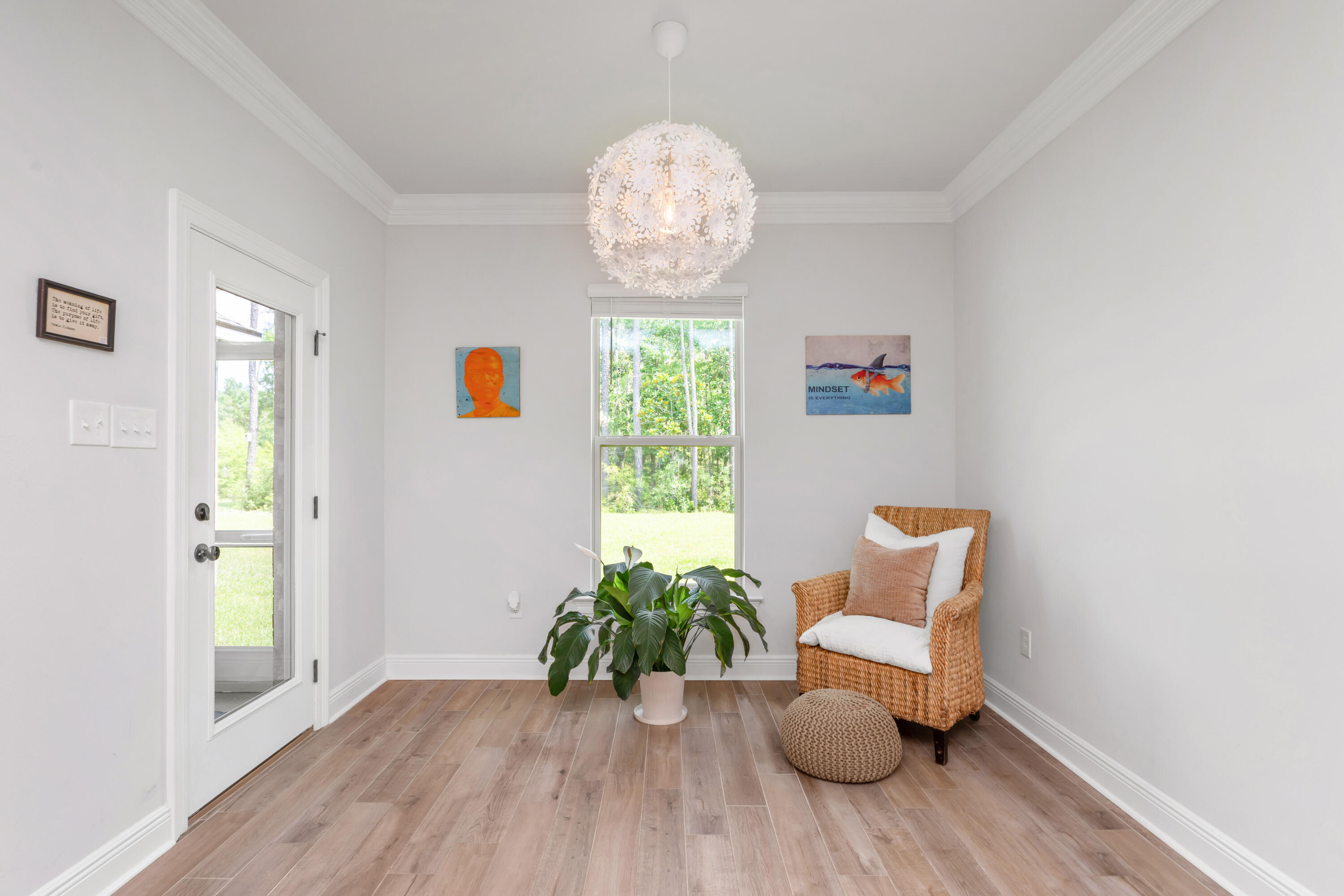 27 Cozy Cove Freeport, FL 32439 - Photo 20 of 80 a view of a hallway with wooden floor and a potted plant