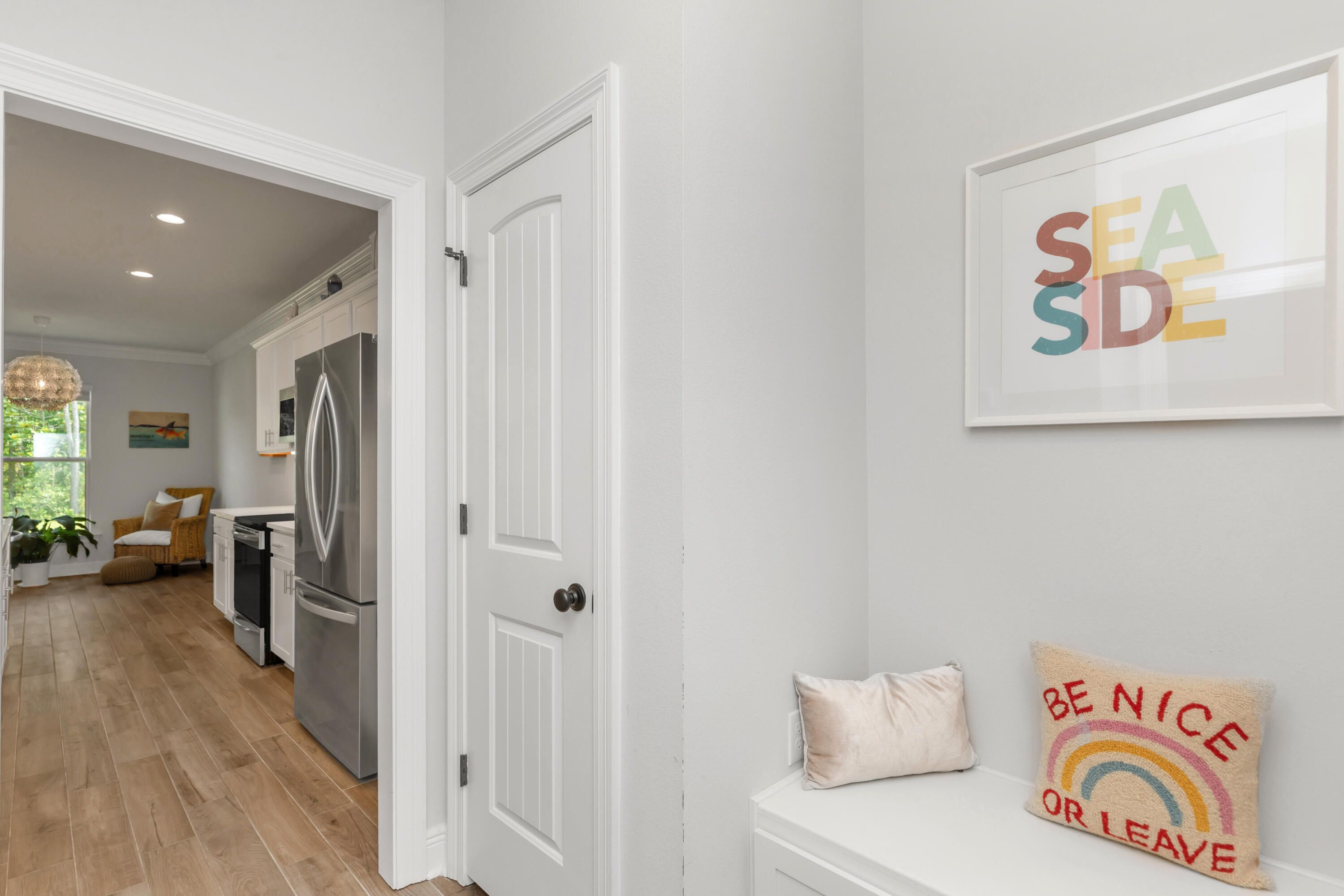 27 Cozy Cove Freeport, FL 32439 - Photo 21 of 80 a view of a hallway with furniture and wooden floor