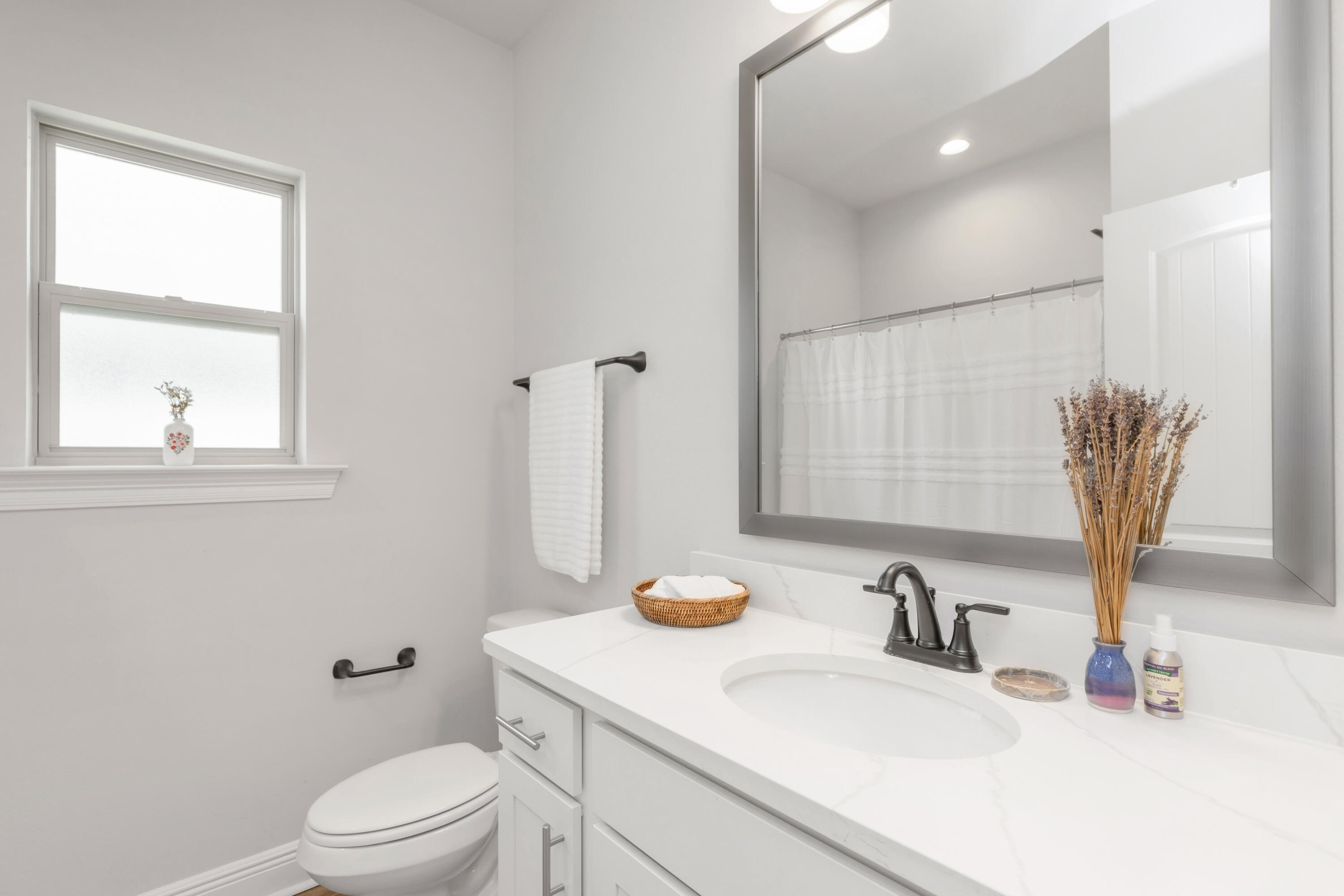 27 Cozy Cove Freeport, FL 32439 - Photo 29 of 80 a bathroom with a granite countertop sink a toilet and a mirror