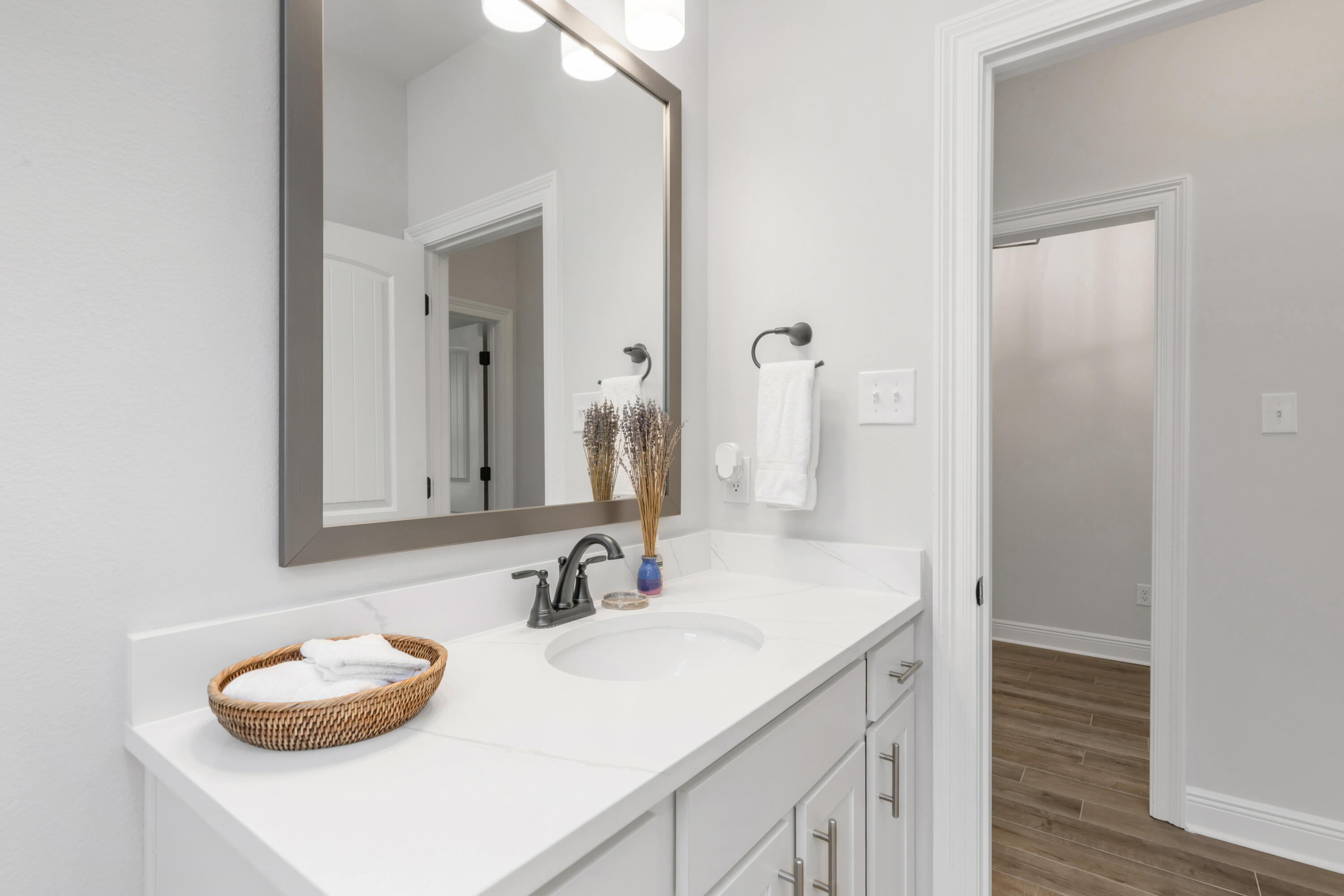 27 Cozy Cove Freeport, FL 32439 - Photo 30 of 80 a bathroom with a granite countertop sink and a mirror