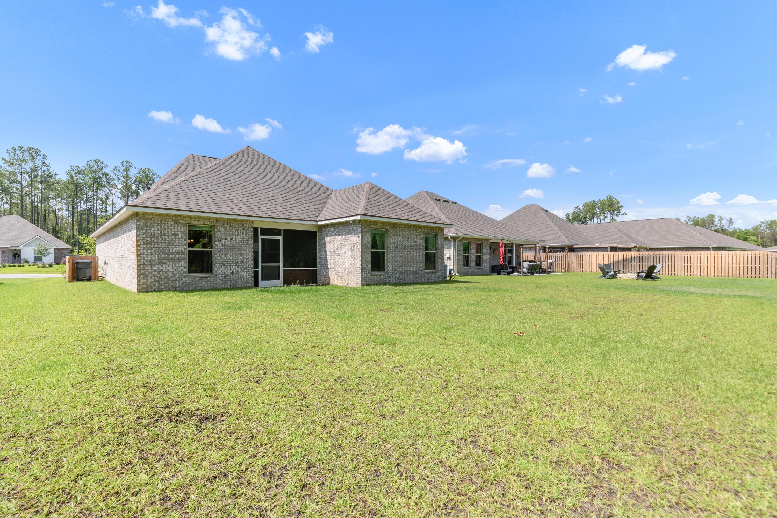27 Cozy Cove Freeport, FL 32439 - Photo 44 of 80 a front view of a house with yard