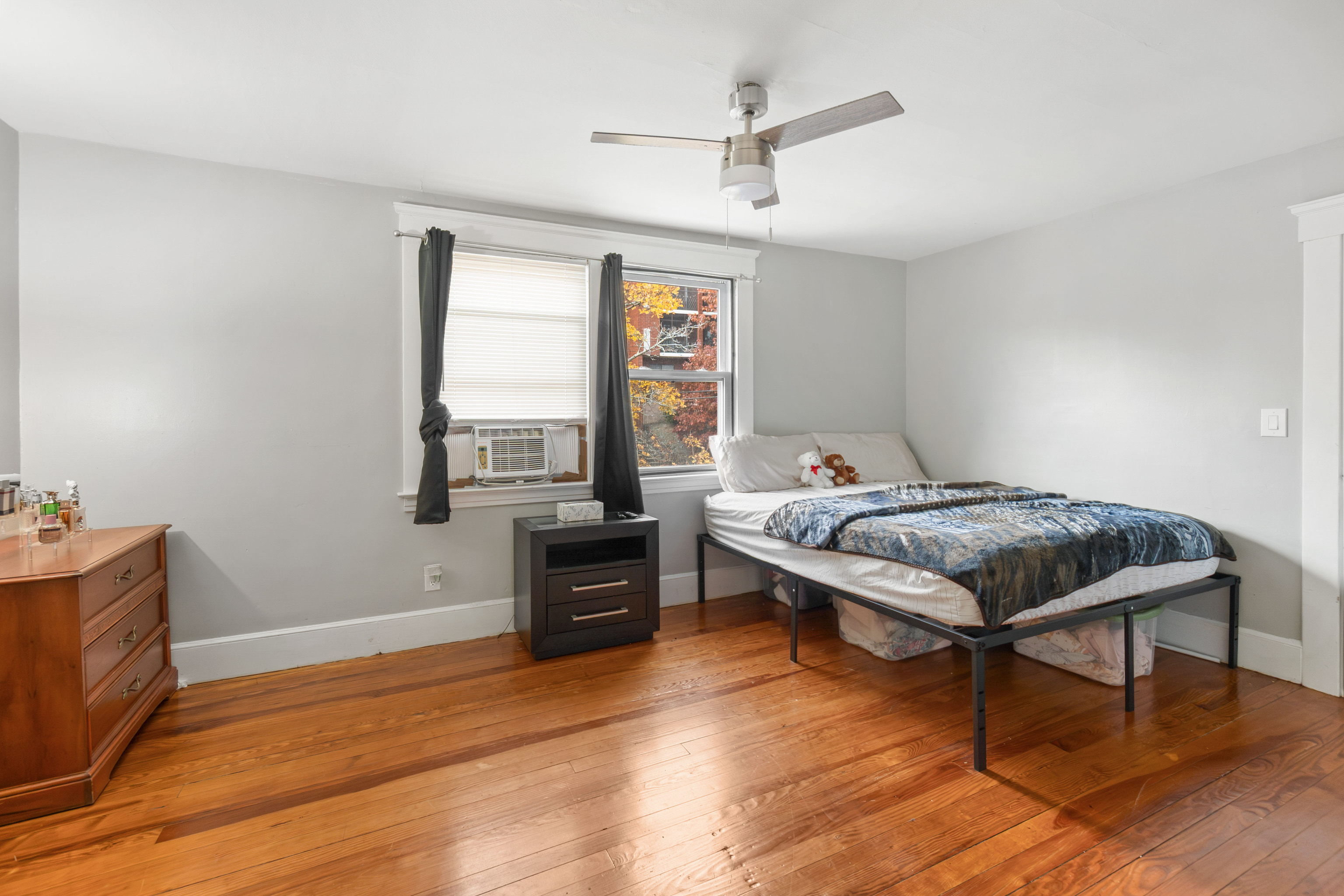 481 Savin Avenue West Haven, CT 06516 - Photo 12 of 21 a bedroom with a bed and wooden floor