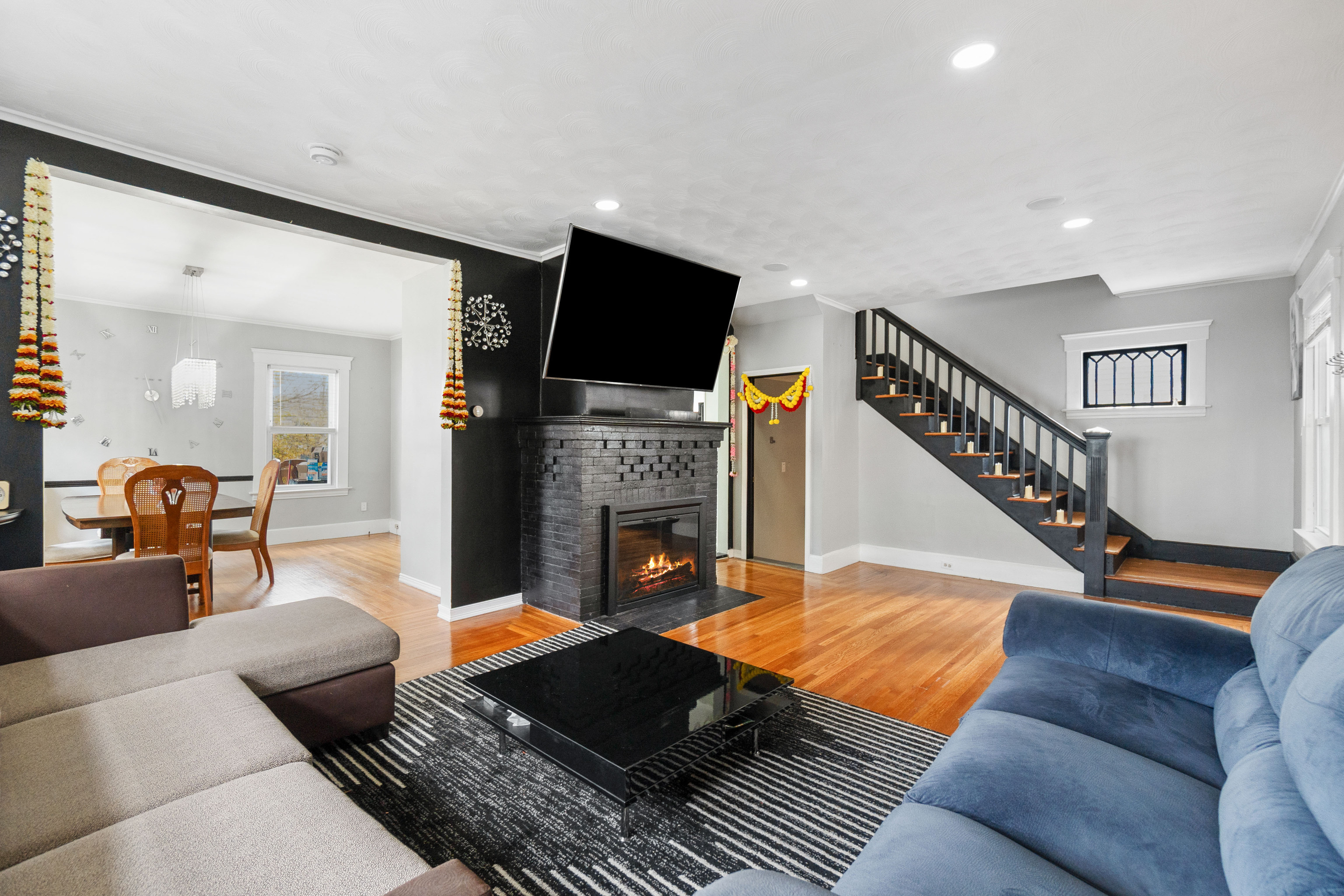 481 Savin Avenue West Haven, CT 06516 - Photo 4 of 21 a living room with furniture and a fireplace