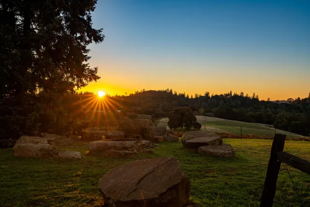 a view of a lake with houses in back