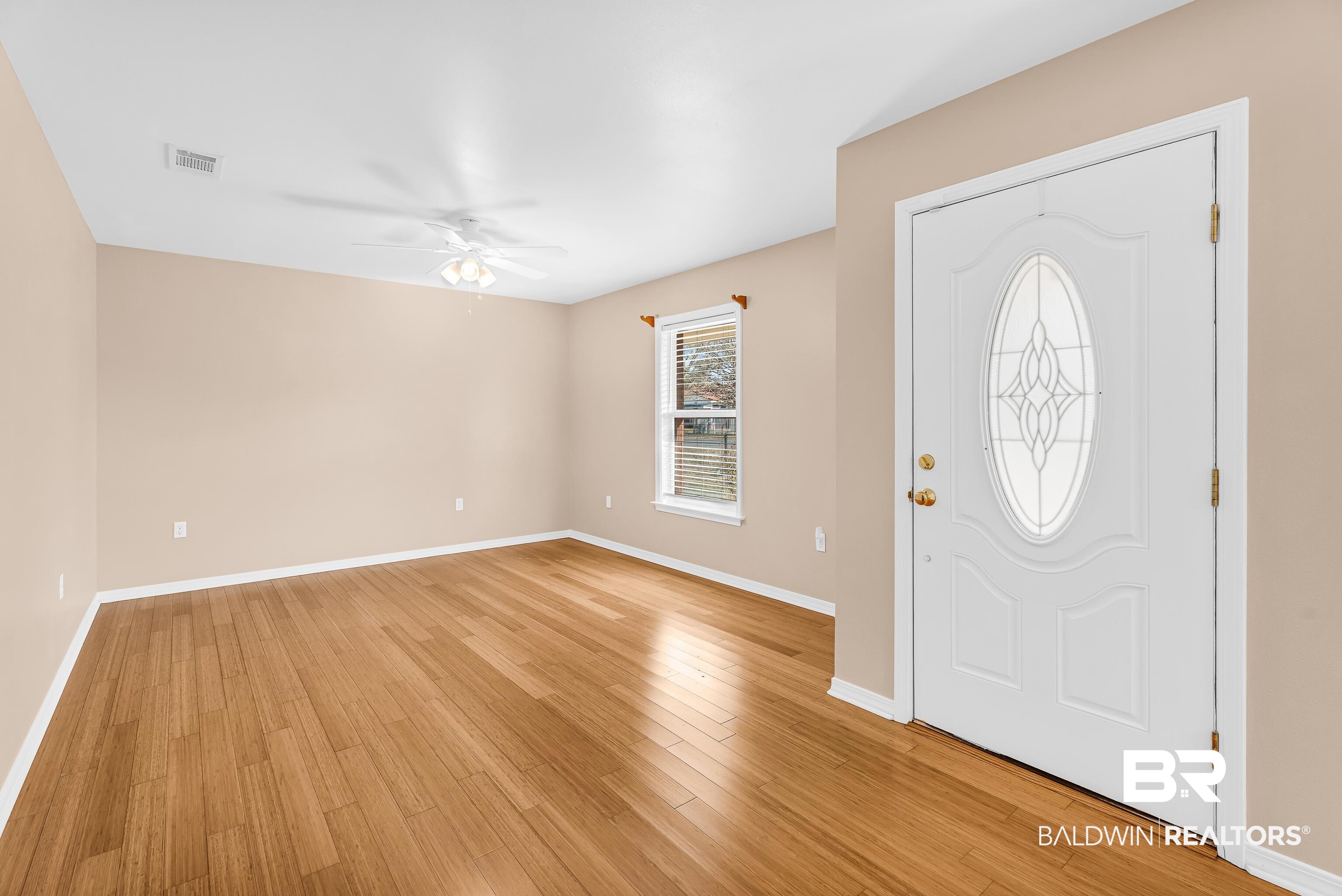 22095 8th Street Silverhill, AL 36576 - Photo 15 of 42 Foyer featuring light wood-style flooring and a ceiling fan