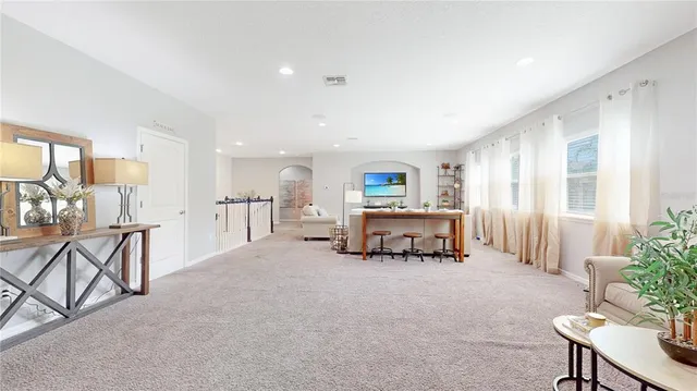 a living room with furniture and a table