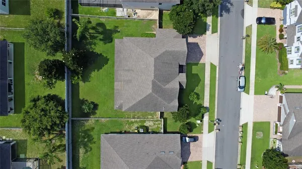an aerial view of a house with a garden