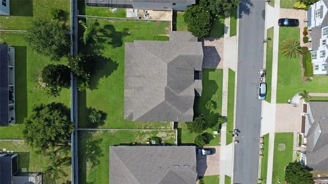 an aerial view of a house with a garden