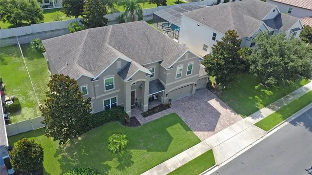 an aerial view of a house with a garden