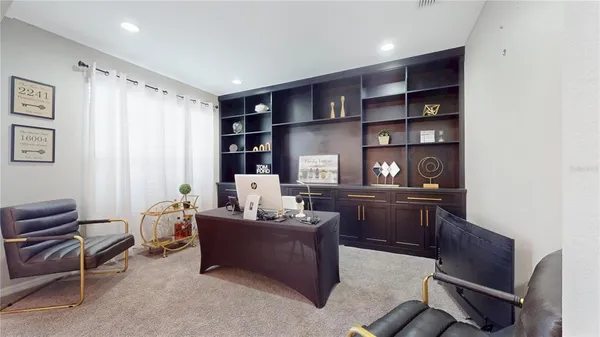 a view of a workspace with furniture