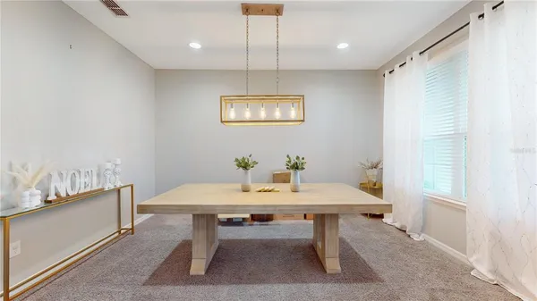 a view of a dining room with furniture
