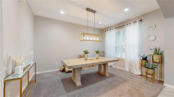 a view of a room with furniture and window