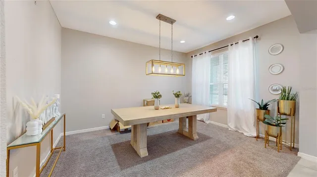 a view of a room with furniture and window