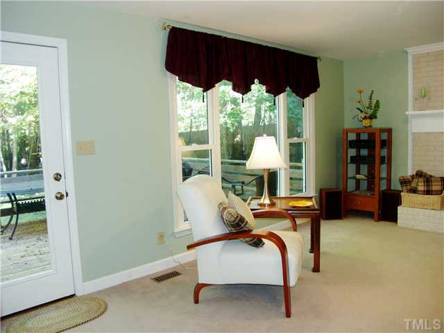 8516 Shadow Wood Place Raleigh, NC 27613 - Photo 14 of 25 View of the back of the family so you can see all the new windows and door leading to the deck. Den/Family/Great Room