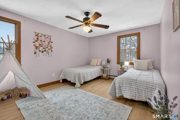 a bedroom with a bed and window