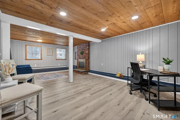 a view of a livingroom with furniture and a table