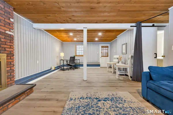 a room with lots of furniture and a window