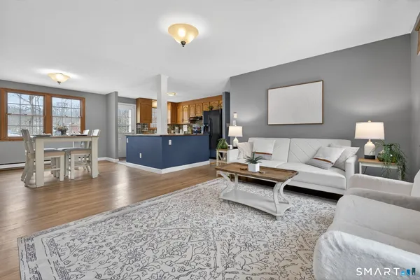 a living room with furniture and a table