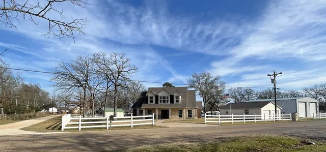 a view of road with card and yard