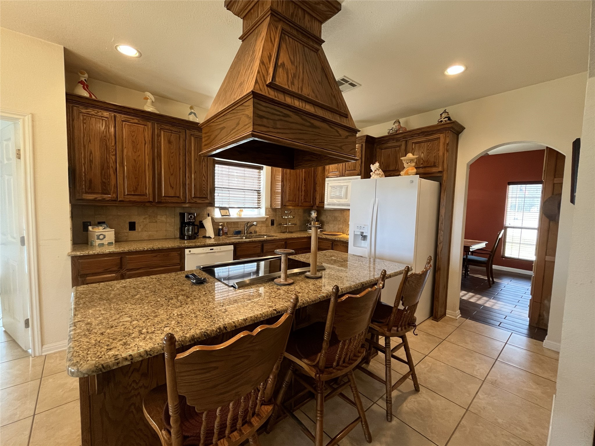 19846 Post Oak Loop Thornton, TX 76687 - Photo 17 of 44 a kitchen with refrigerator and chairs