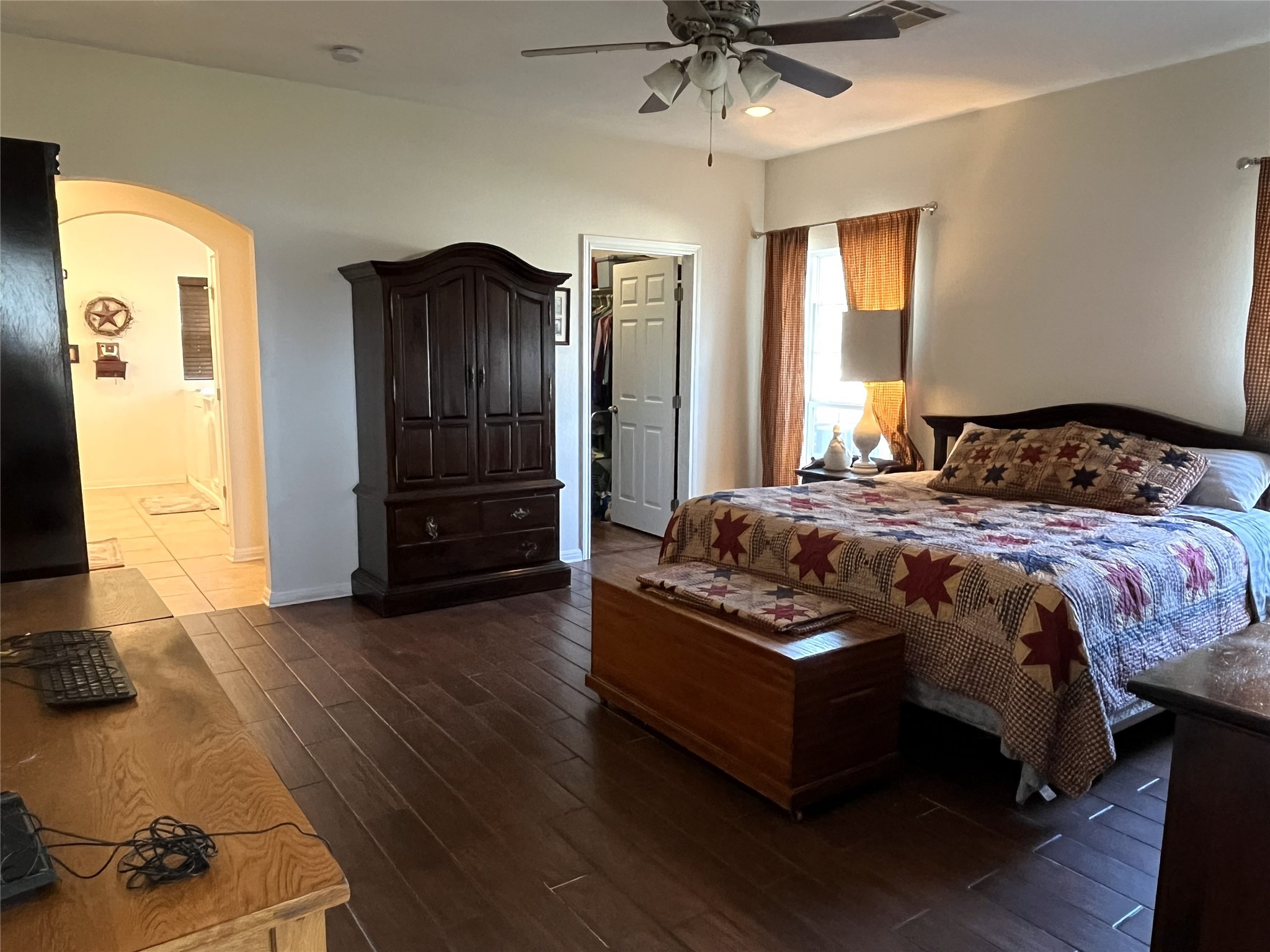 19846 Post Oak Loop Thornton, TX 76687 - Photo 29 of 44 a bedroom with a bed and a chandelier