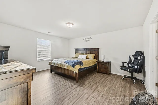 a bedroom with a bed and a table in it