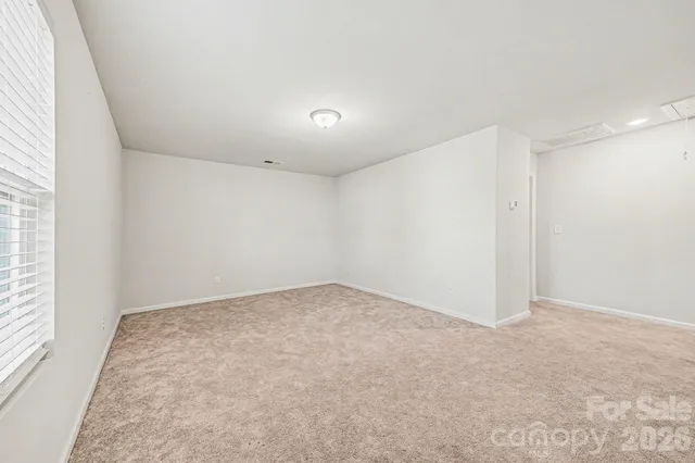 a view of a backyard of the house